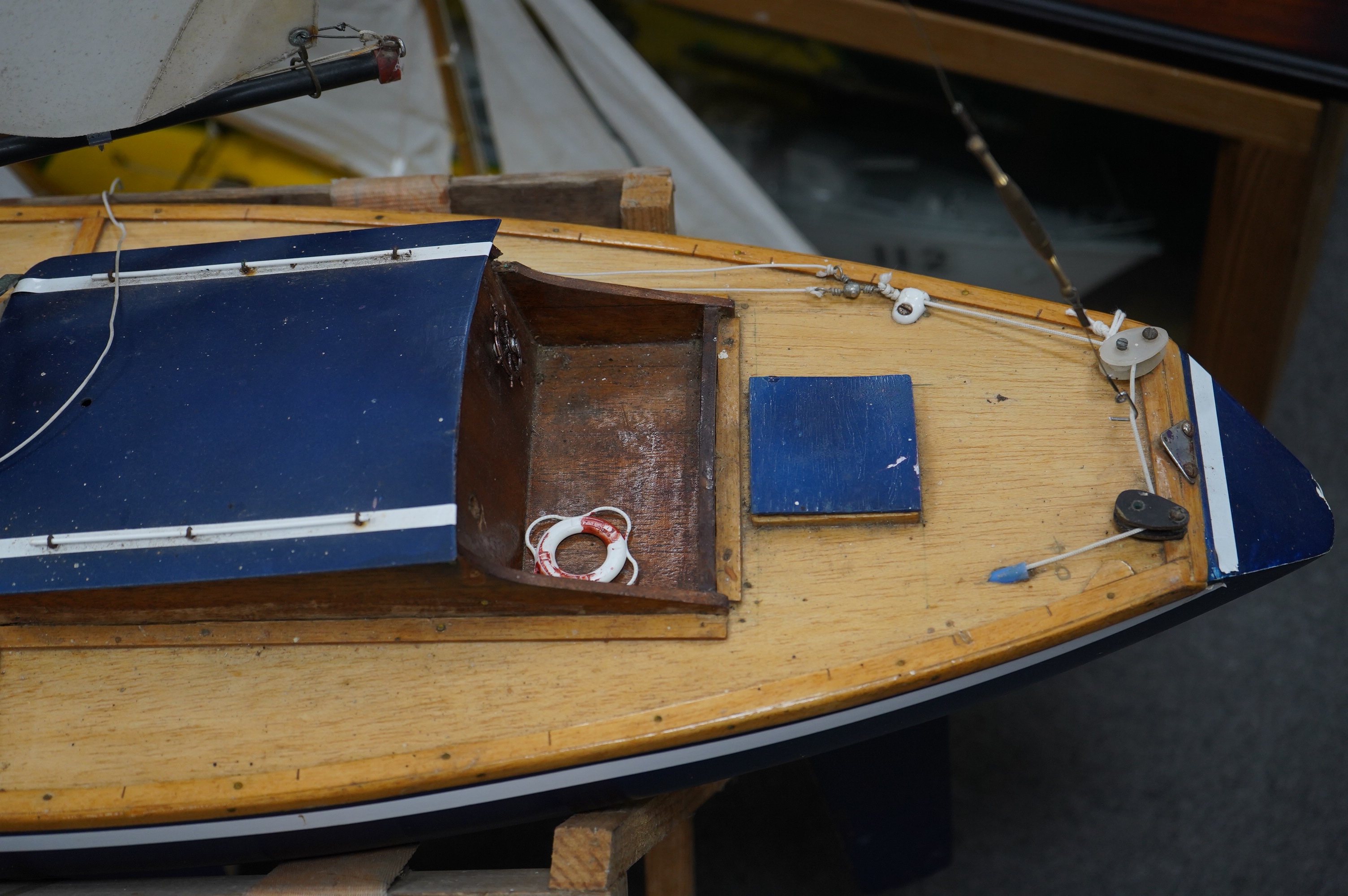 A large pond yacht, of wooden construction with some detailing to the deck, approx 250cm high, hull 120cm. Condition - fair to good.